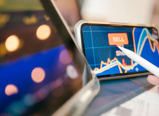 Trader across multiple markets reviewing Bitcoin, Ethereum, and forex options